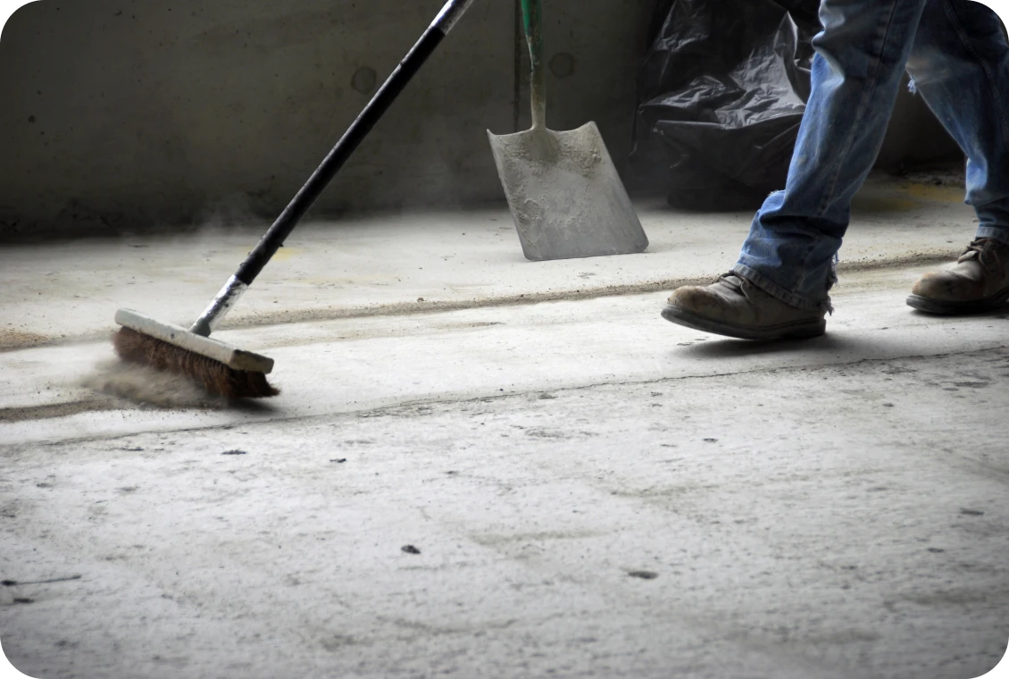 Worker cleaning construction site